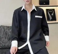 ストライプ模様の長袖シャツ 黒と白