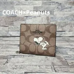 COACH × Peanuts スヌーピー柄 二つ折り財布 シグネチャー柄
