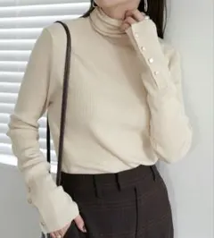 ディスコートリブ袖口ボタンタートルアイボリーレディースリブニット
