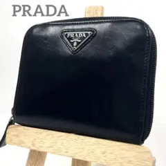 プラダ　二つ折り財布　ラウンドファスナー　三角ロゴプレート　レザー　ブラック