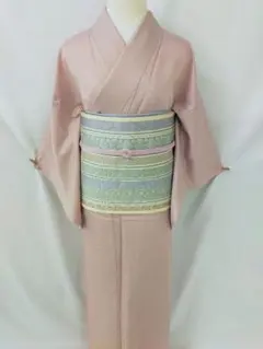 新品未使用　洗える紋意匠色無地　単衣　Lサイズ　くすみピンク　ポリ　裄68のサムネイル