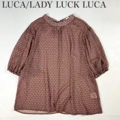 ルカレディラックルカ 美品 総柄 ビックリボン ボリュームシフォン五分袖ブラウスのサムネイル