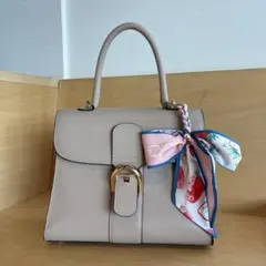 ベージュ ハンドバッグ ゴールドバックル　リボン付き