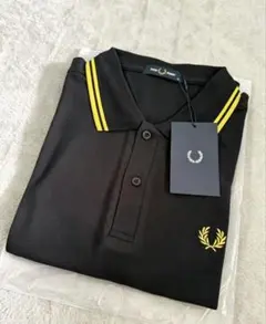 FRED PERRY ポロシャツ ブラック×ゴールド フレッドペリータグ付き新品のサムネイル