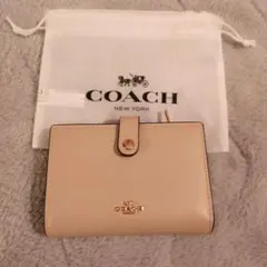 COACH ベージュ 二つ折り財布 保存袋付き