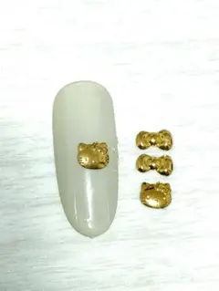 キティ　リボン　ネイルパーツ　スタッズ　ゴールド　サンリオ　ミニパーツ