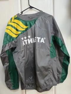 ATHLETA ピステ・ウィンドブレーカー グレー/グリーン