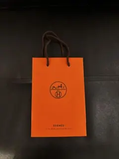 HERMES オレンジ ロゴ入り紙袋