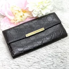 GUCCI シマ ロゴプレート 長財布 Wホック ダークブラウン - メルカリ