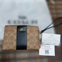 COACH シグネチャー リストレット ポーチ ダークブラウンブラックのサムネイル