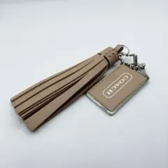 COACH コーチ　ロゴプレート　キーホルダー　バッグチャーム　タッセルのサムネイル