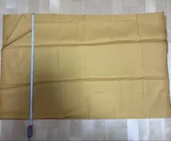 生地 マスタード色 光沢 ハリ