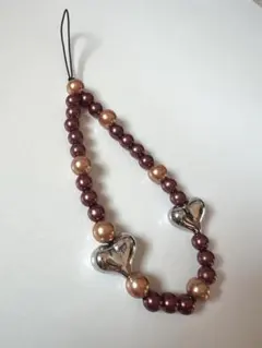 【ハンドメイド】ハート型メタルとブラウン系ビーズの携帯ストラップ