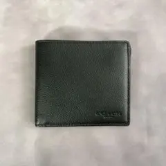 美品　COACH コーチ　二つ折り財布　札入れ　型押しロゴ　レザー　ブラック