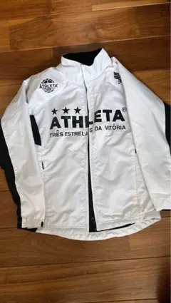 値下げキッズ　白　ATHLETA ピステ・ウィンドブレーカー 140