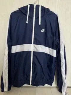 人気商品！ NIKE athletics East 青、グレーナイロンパーカー - メルカリ