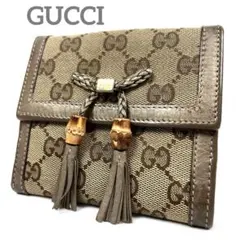 グッチ　折り財布　GGキャンバス　リボン　ロゴ総柄　バンブータッセル　レザー