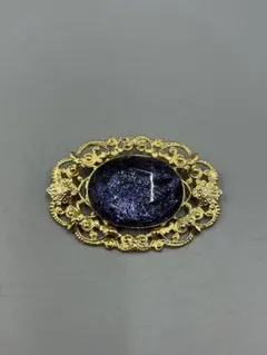 253ヴィンテージ　装飾的な金色ブローチ 黒紫色ストーン
