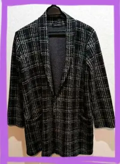 チェックの 黒いコート