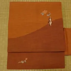 丹色に花瓶の花　名古屋帯のサムネイル