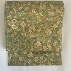 正絹九寸名古屋帯 型染め 素敵なデザイン 花柄　グリーン系　全通