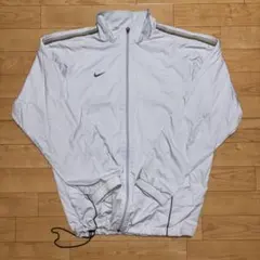 NIKE STORM-FIT ナイロンジャケット ベージュ×ボルドー - メルカリ