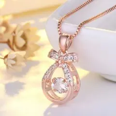 リボン ティアドロップ ダンシングストーンジルコニア ピンクゴールド ネックレス