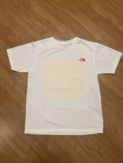 【THE NORTH FACE】ホワイトTシャツ オレンジイエロープリント