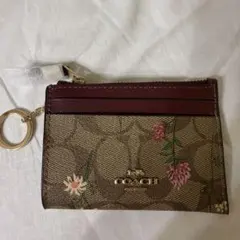 COACH直営店コーチシグネチャー 刺繡フローラルスムース ミディアム二