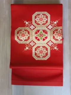 名古屋帯 亀甲に華文 古典吉祥文様 朱色 金糸