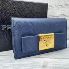 美品】PRADA サフィアーノレザー 名刺入れ リボン ネイビー - メルカリ