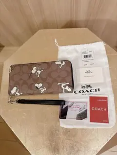 COACH 長財布　peanutsコラボ　スヌーピー　ストラップ付き