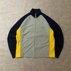 90s古着NIKEトラックジャケット刺繍口ゴスウッシュY2K イエローDB278
