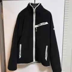 TOMMY JEANS ブラックフリースジャケット