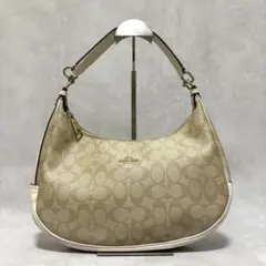 コーチ　ハンドバッグ　ハーフムーン　シグネチャー　ベージュ f58288