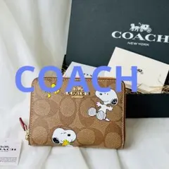 ⭐︎匿名配送⭐︎COACH スヌーピー 二つ折り財布 ネイビー　新品未使用 新作新品未使用】COACH コーチスヌーピーコラボ二つ折り財布 - メルカリ
