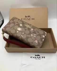 コーチ C8736 シグネチャー花柄 ラウンドジップ長財布