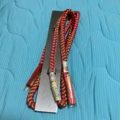 赤と金の帯飾り タッセル付き