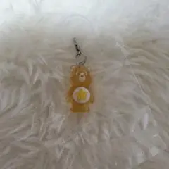 ケアベア　めじるしアクセサリー　クリアマスコットチャーム2 オレンジ　ガチャ
