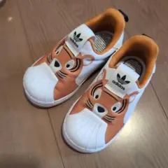 adidas トラ顔スリッポンシューズ オレンジ/ホワイト