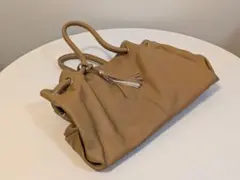カリーノ　牛革　タッセル　バック　キャメル フリンジ付き ハンドバッグ