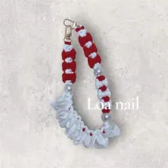 赤と白のリボンフリル編み込み携帯ストラップ
