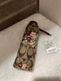 COACH シグネチャー 花柄 折りたたみ傘 晴雨兼用のサムネイル