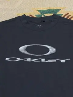 オークリー オーバルロゴ Tシャツ スミクロ フェード L - メルカリ