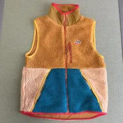 Nike フリースベスト オレンジ/青/ベージュ