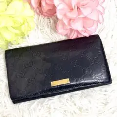 グッチ 長財布 フラップ シマ レザー リボン インターロッキング 黒