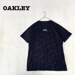 DE0724【オークリー OAKLEY】Tシャツ【XL】総柄 ロゴワンポイントのサムネイル