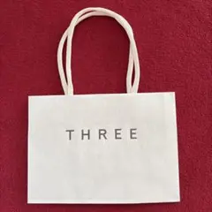 スリー THREE ショッパー 紙袋のサムネイル