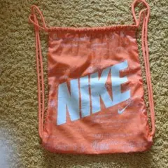 NIKEロゴデザイン オレンジ色 ドローストリングバッグ ナップサック