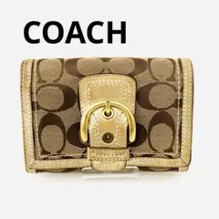 【COACH】シグネチャー柄の二つ折り財布／収納力◎ ゴールド 金運UP！